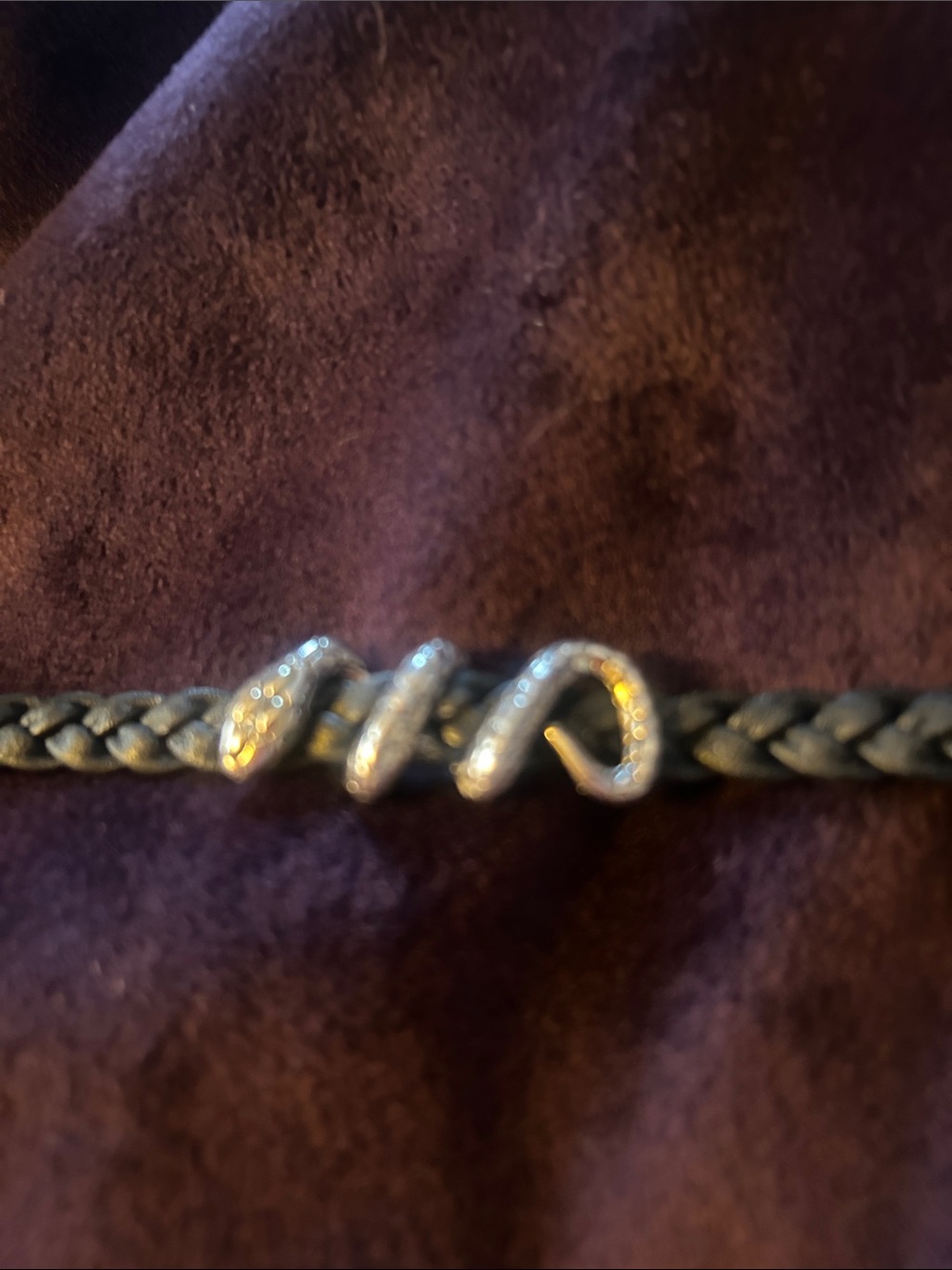 Thai snake bracelet of silver and leather with gold accents.